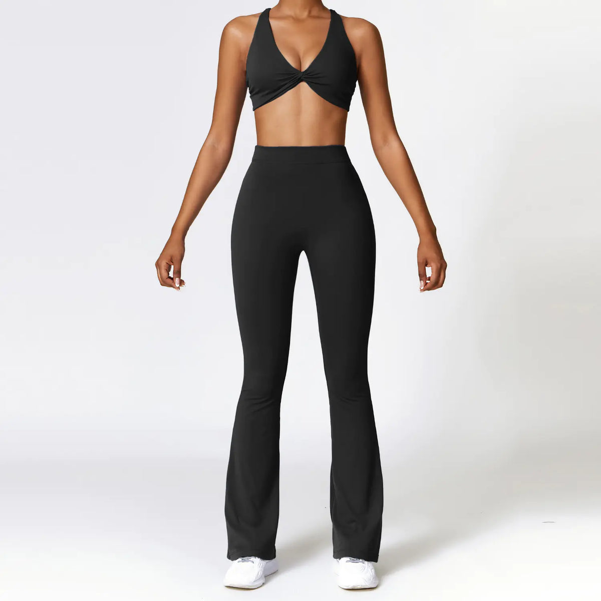 Volute twist halter bra and flared legging set in black, front